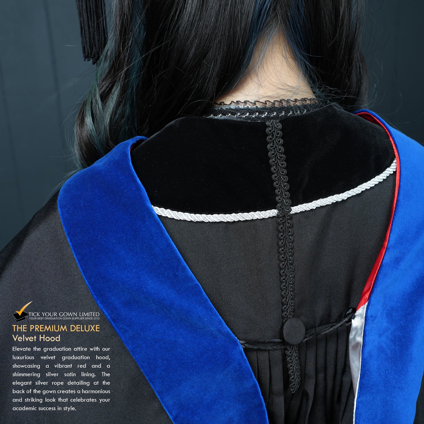 Close-up back view of a masters graduation gown showing the blue velvet hood with red trim and silver lining detail.