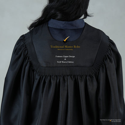 An upper back detailed view of a person wearing a traditional black master's robe for the blue hood set