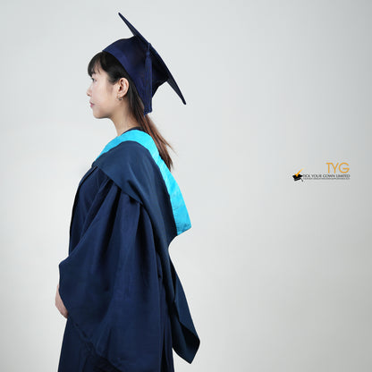 A side view of a person wearing a blue graduation gown and cap on a white background