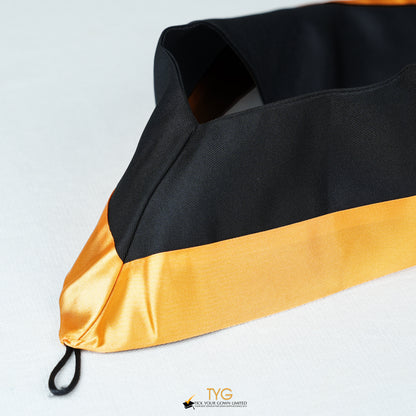Detailed view of a bachelor’s hood in black with gold satin lining.