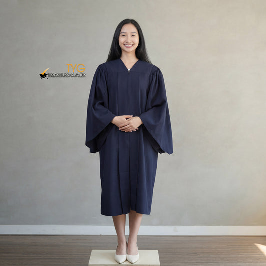A person wearing a classic navy blue graduation gown against a plain background
