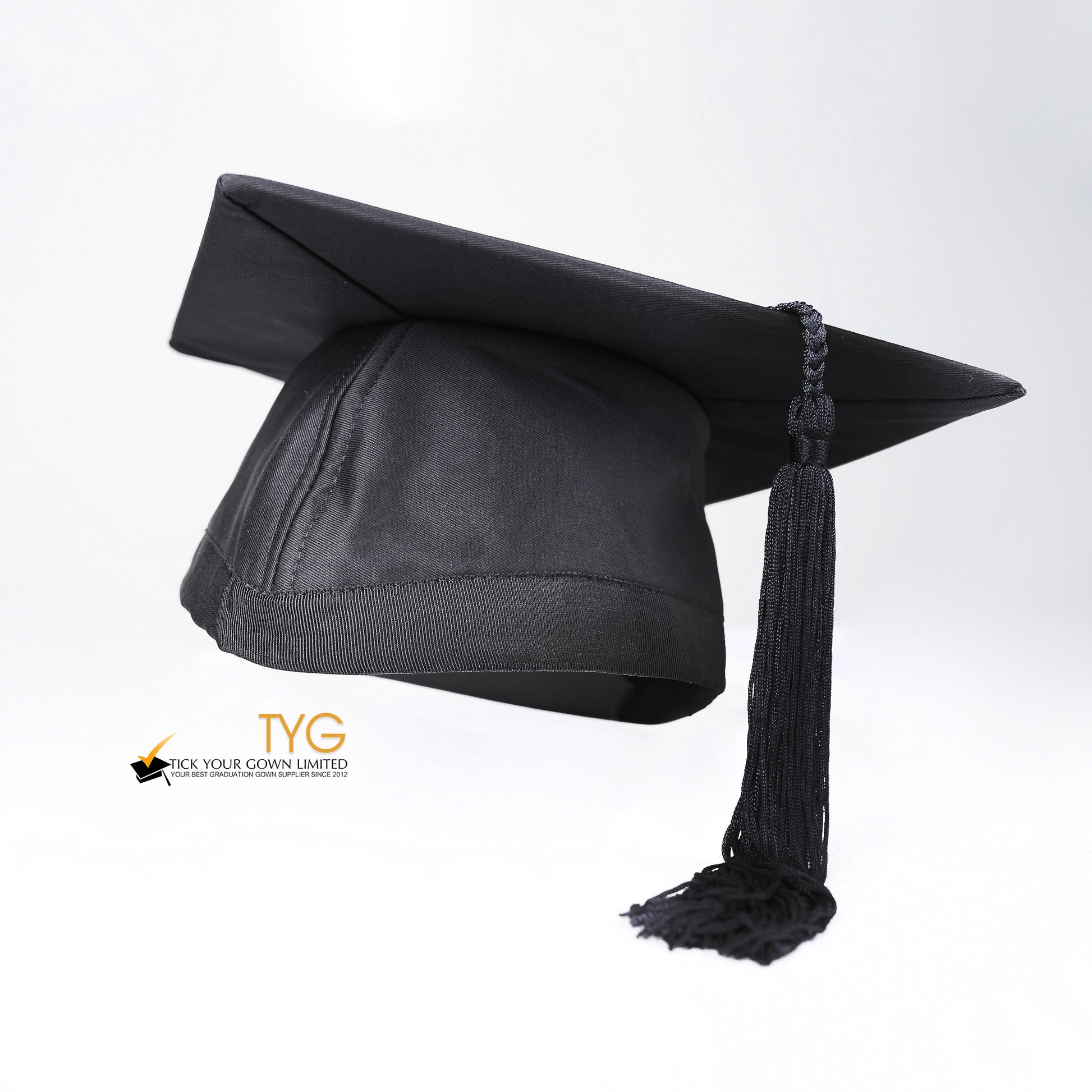 Black graduation cap with a black tassel on a white background.