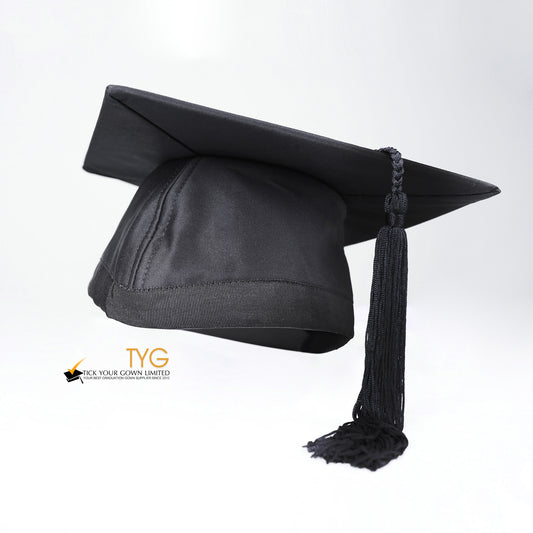 Black graduation cap with a black tassel on a white background.