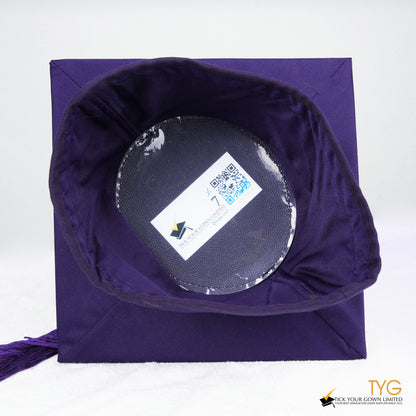 A detailed view of a purple tassel on a white background.