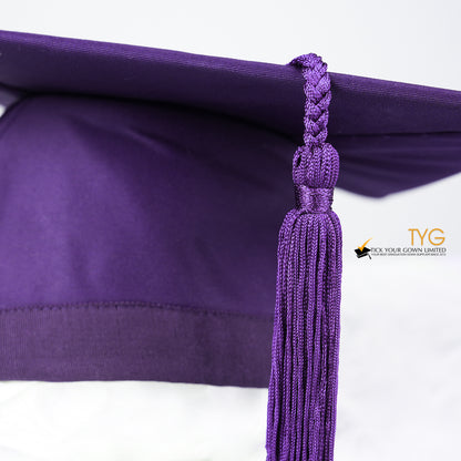 A detailed view of a purple tassel on a white background.