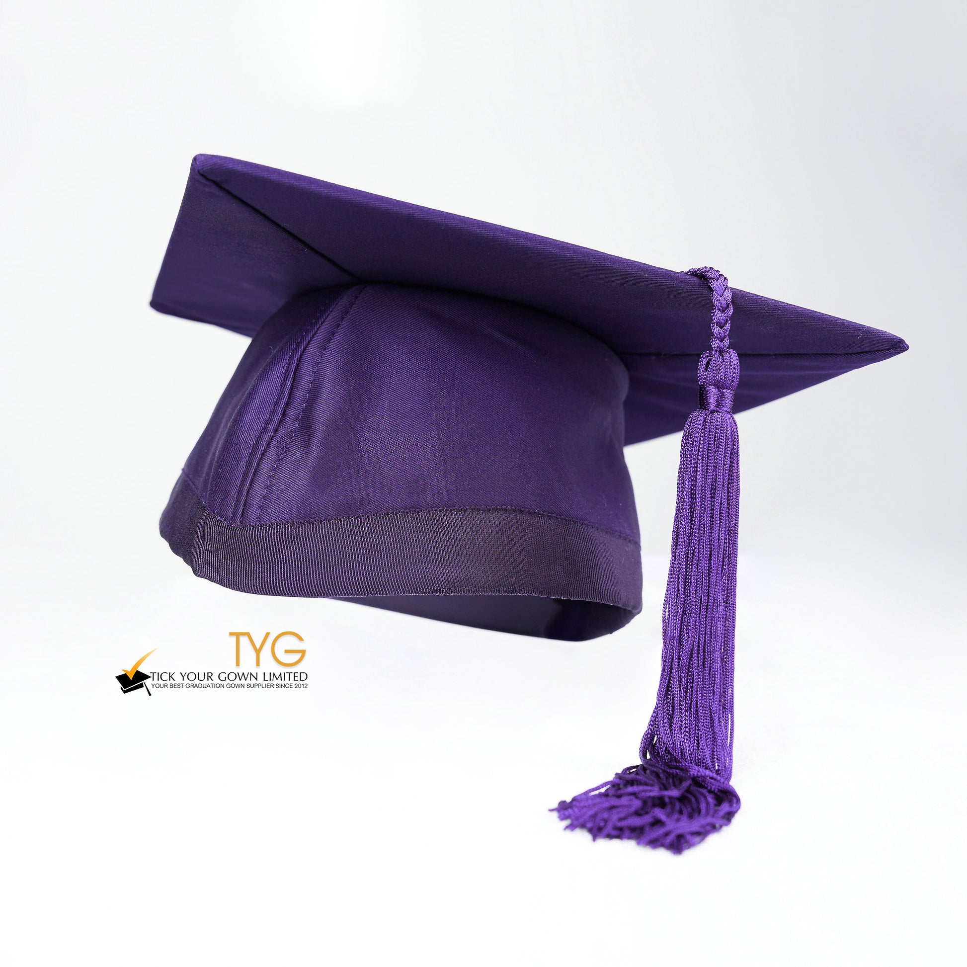 Purple graduation cap with a purple tassel on a white background.