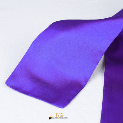 Detailed view of a purple graduation sash fabric on a white background.