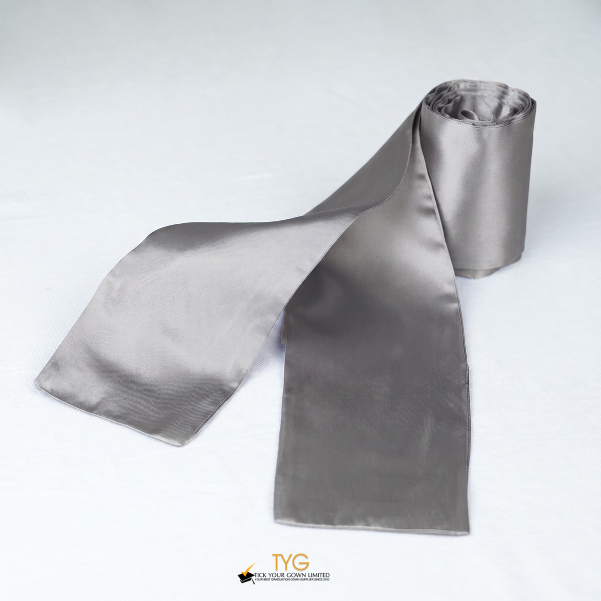 Silver satin rolled graduation sash on a white background.
