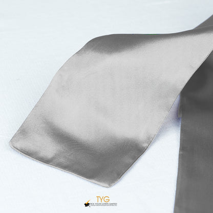 Detailed view of a silver graduation sash fabric on a white background.