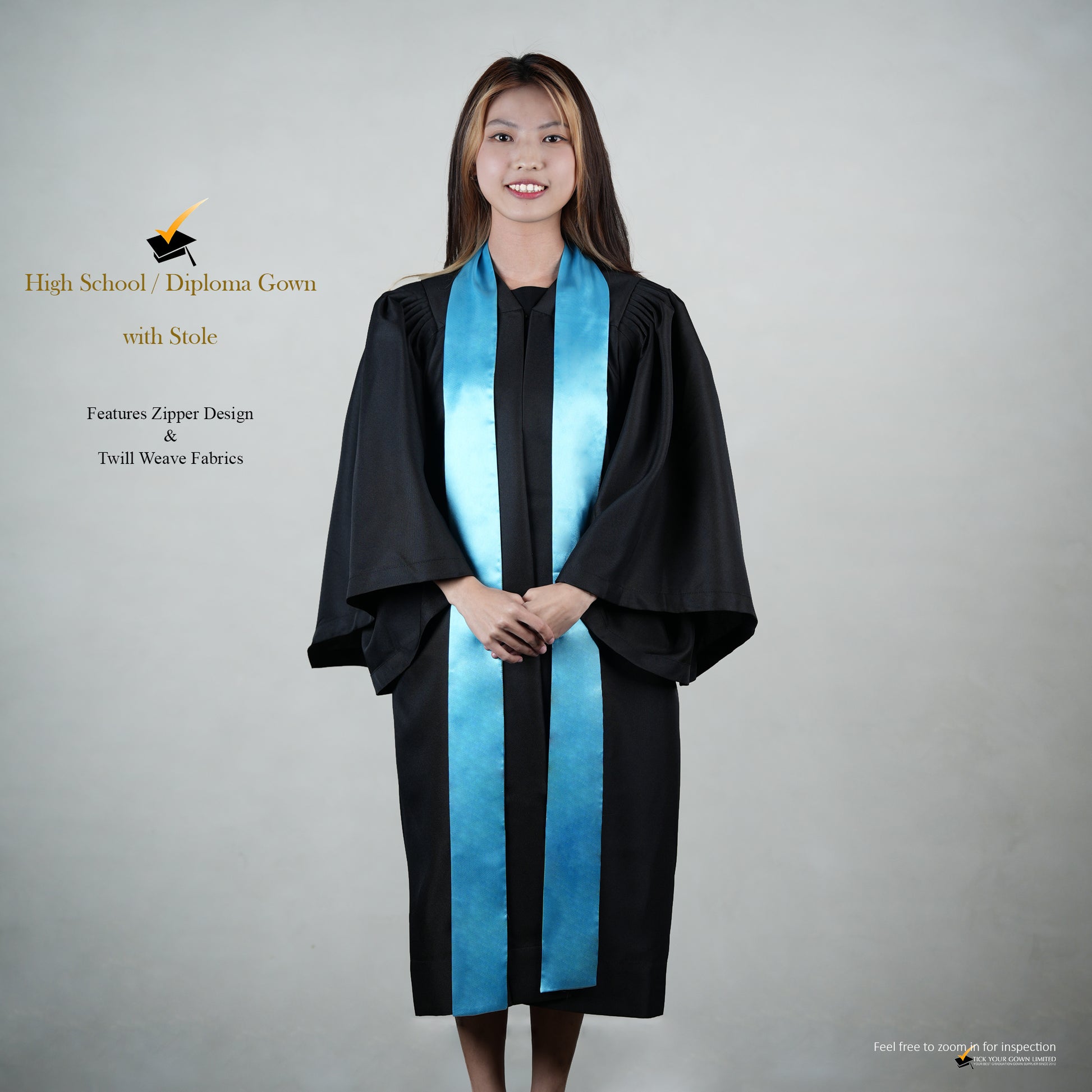 A person wearing a black high school graduation gown with a blue satin stole, shown in a full-length front view.