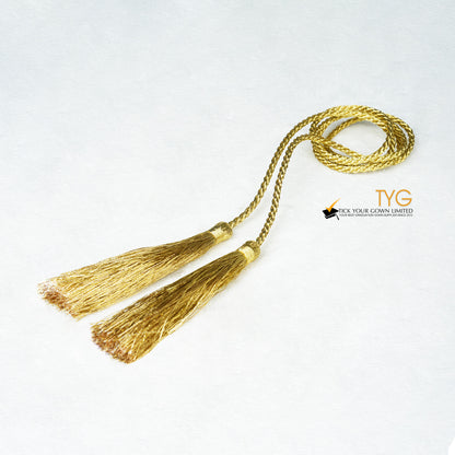 Gold tassel on a white background