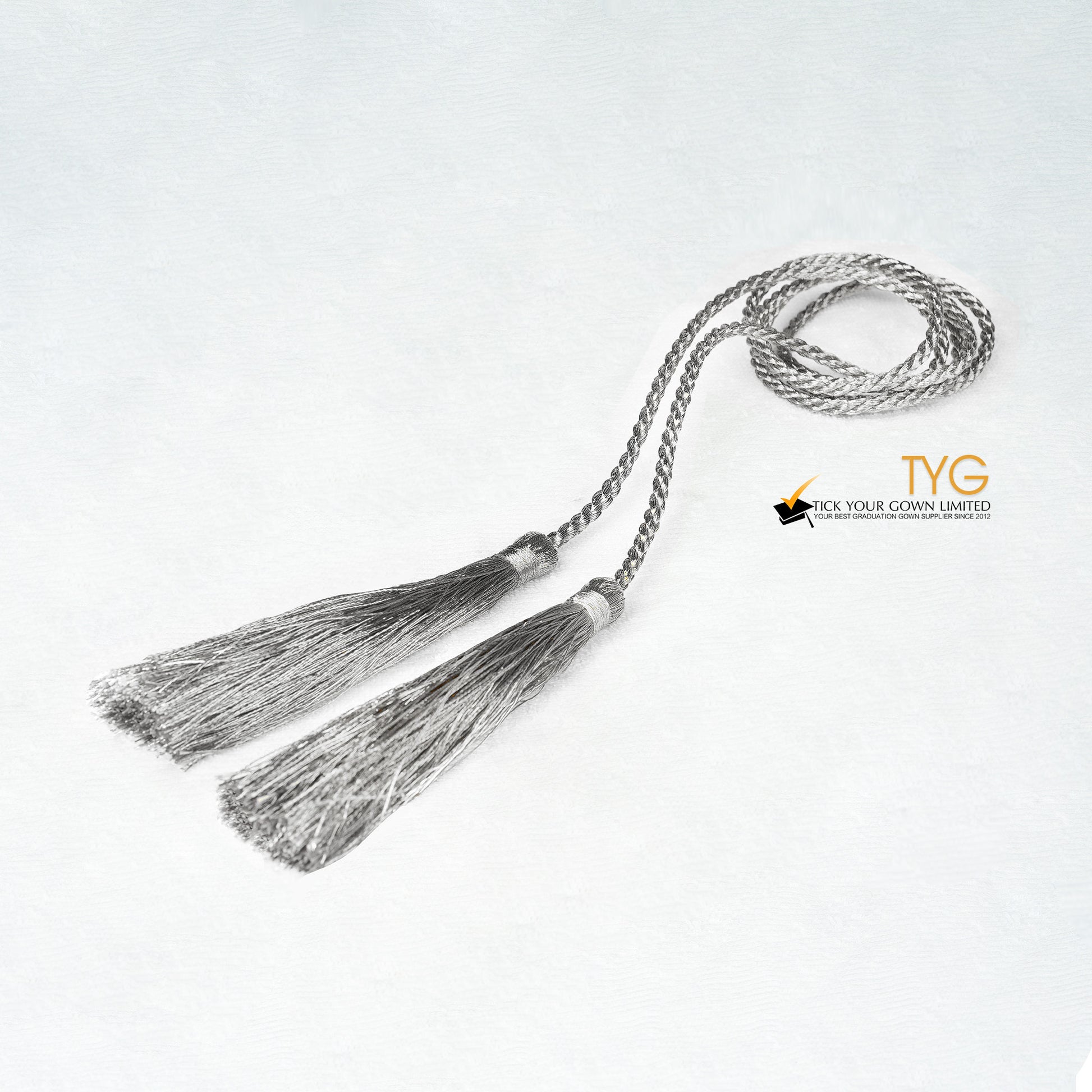 Silver tassel on a white background