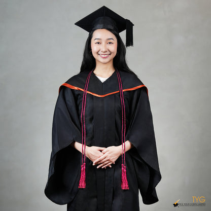 Graduate in black cap and gown with red honour cords on a gray background