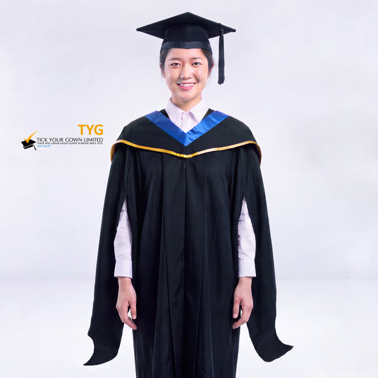 A woman in a black master's graduation gown classic UK with a blue hood with gold trim accent and with a black mortarboard cap with a black tassel against a gray background.
