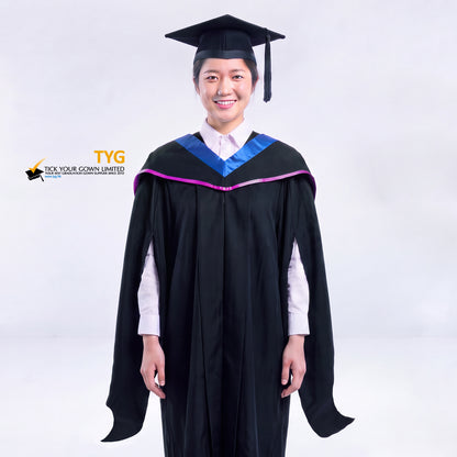 A woman in a black master's graduation gown classic UK with a blue hood with light purple accent and with a black mortarboard cap with an black tassel against a gray background.