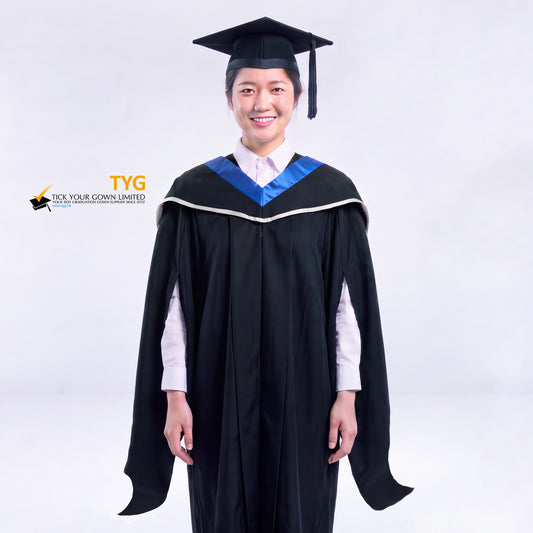 A woman in a black master's graduation gown classic UK with a blue hood with silver accent and with a black mortarboard cap with an black tassel against a gray background.