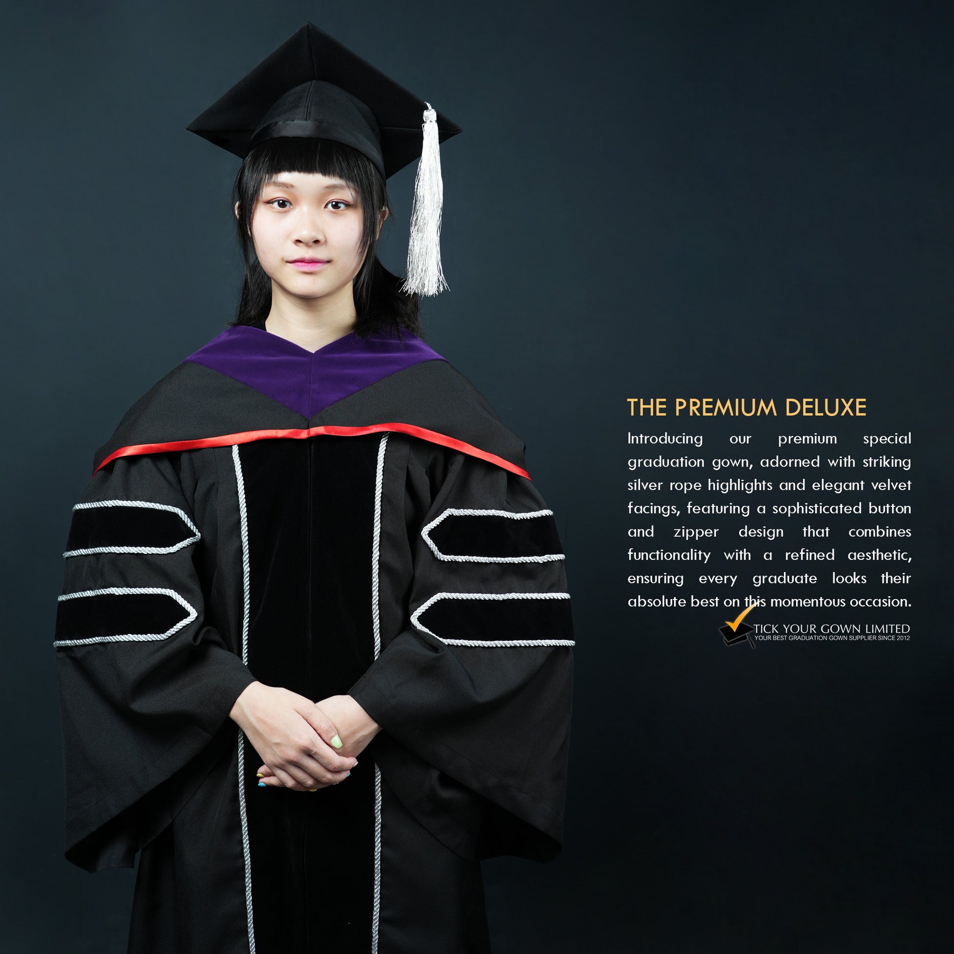 A person wearing a black velvet graduation gown with silver lining and a purple-and-red hood, a mortarboard witha silver tassel, standing in front of a dark background, with text describing the product as 'THE PREMIUM DELUXE'.