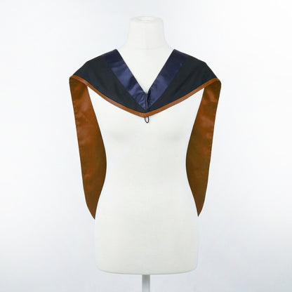 Master's graduation hood displayed on a mannequin showing full shape with black body, dark navy blue hood, and brown satin lining.
