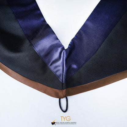 Close-up of a master's graduation hood with black body, dark navy blue satin hood and brown lining.
