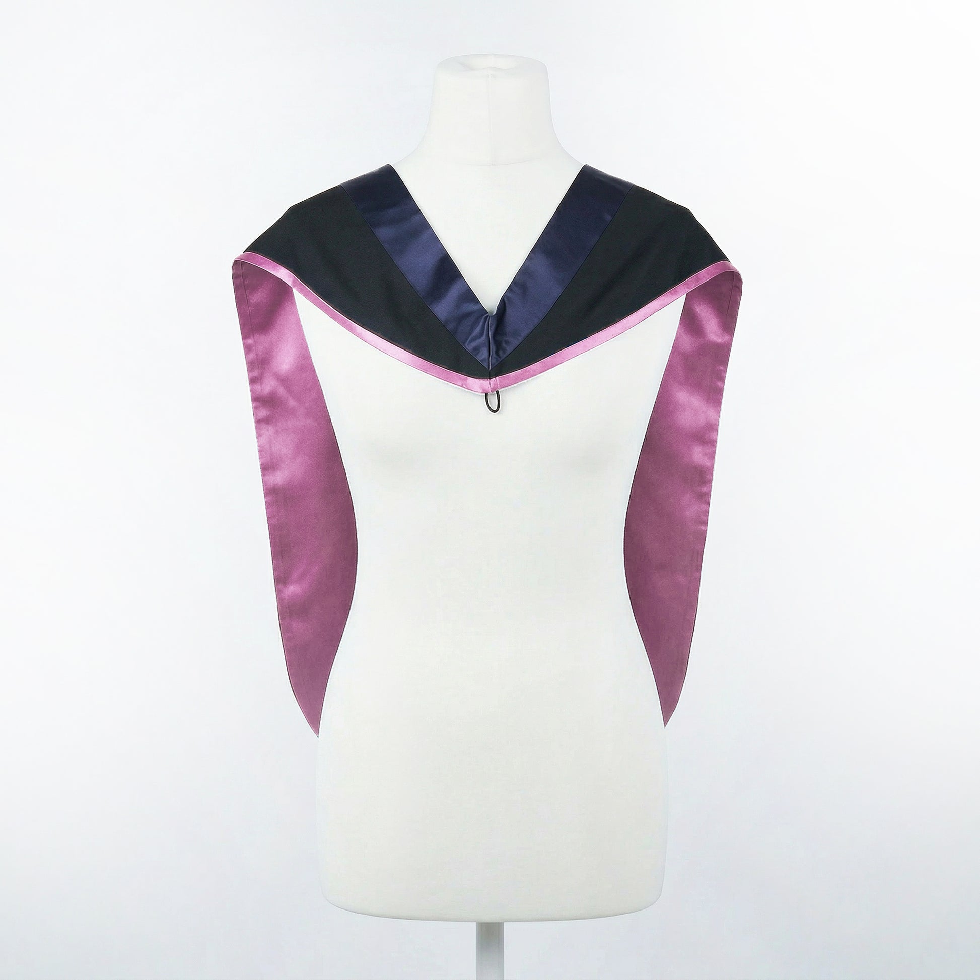 Master's graduation hood displayed on a mannequin showing full shape with black body, dark navy blue hood, and lilac satin lining.