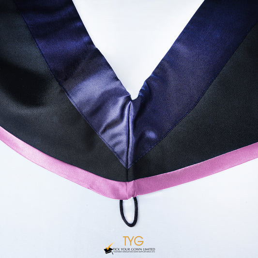 Close-up of a master's graduation hood with black body, dark navy blue satin hood and lilac lining.