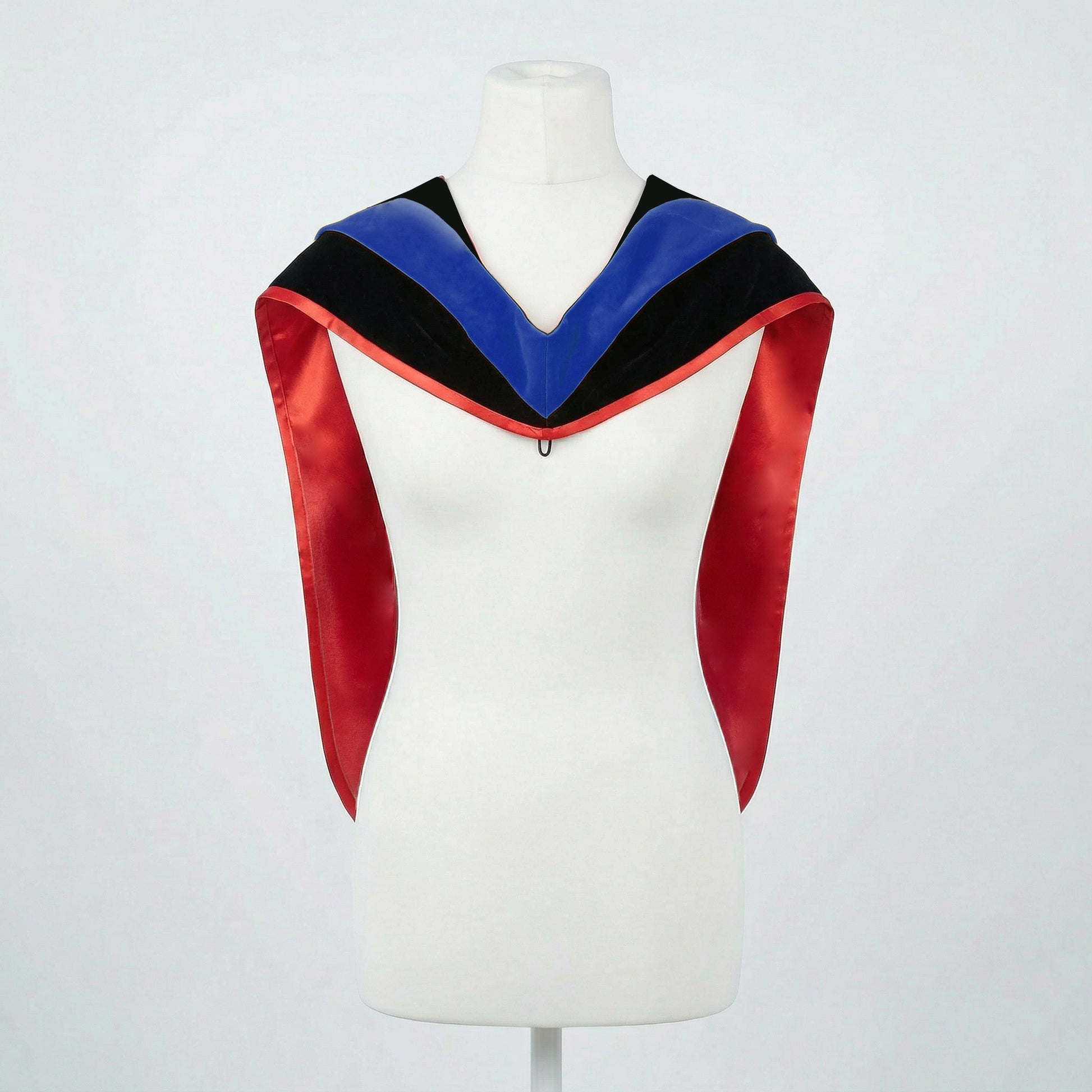 Master's graduation hood displayed on a mannequin showing full shape with black velvet body, blue velvet hood and red satin lining.