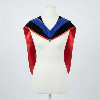 Master's graduation hood displayed on a mannequin showing full shape with black velvet body, blue velvet hood and red satin lining.