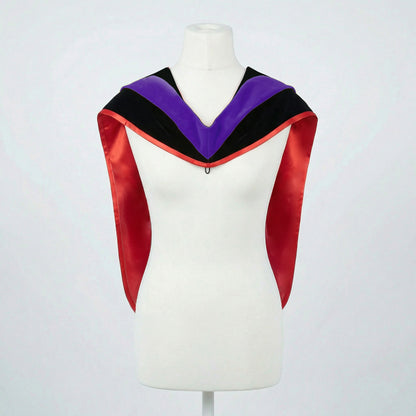 Master's graduation hood displayed on a mannequin showing full shape with black velvet body, purple velvet hood and red satin lining.