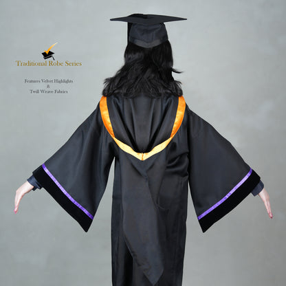 A back view of a woman posing in a black Traditional Master's graduation regalia featuring a black gown, orange hood satin polyester trim, wide bell sleeves trimmed with purple satin with black velvet cuffs, and a matching black mortarboard cap.
