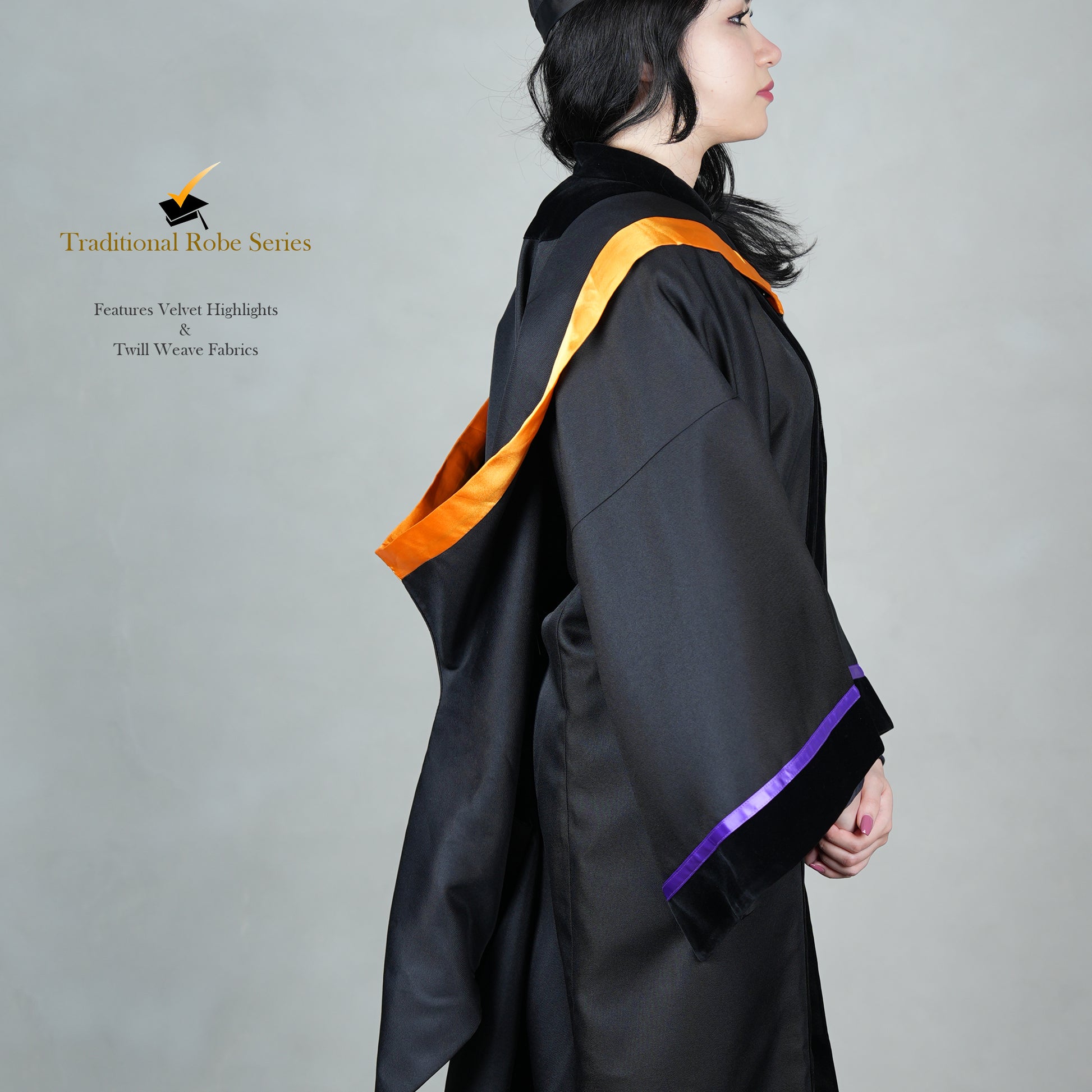 A person wearing a black bachelor graduation gown in side view with satin polyester highlights, snap-on hood design, and a mortarboard set.