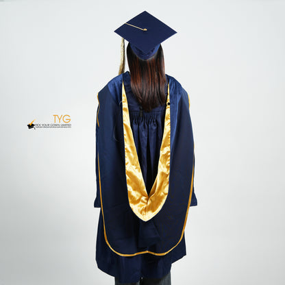 A back view of a person wearing a PhD classic navy blue velvet graduation gown with yellow lining hood, and a navy blue doctoral bonnet with gold tassel.