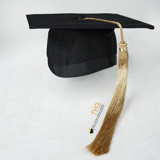 Black graduation cap with gold tassel on a white background