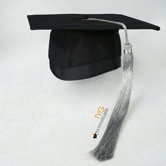 Black graduation cap with silver tassel on a white background