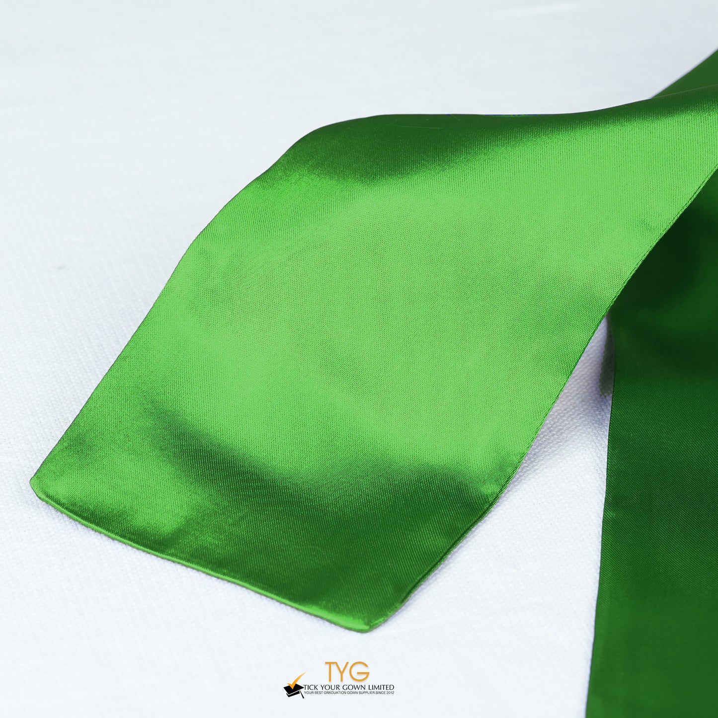 Detailed view of a green stole fabric on a white background.