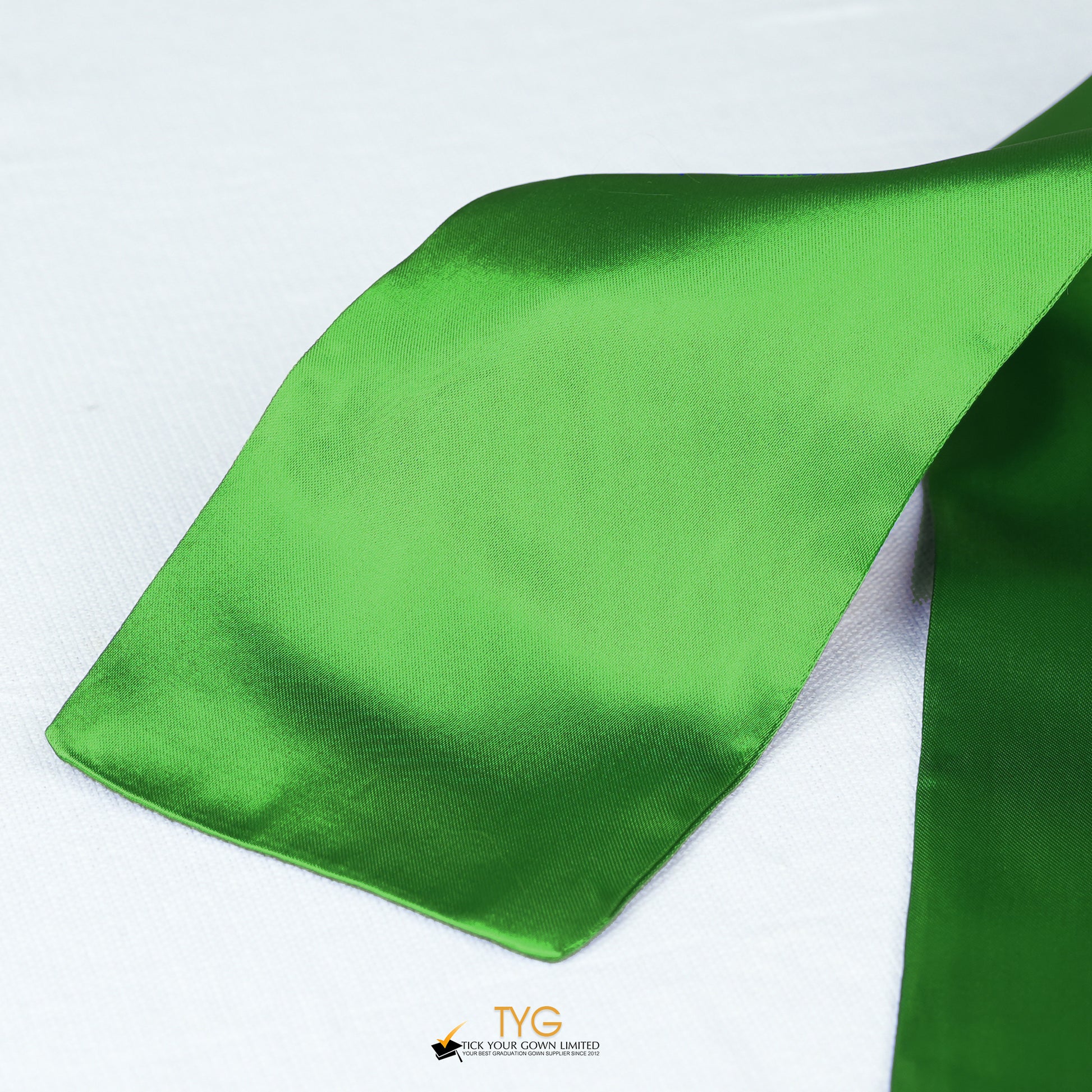Detailed view of a green stole fabric on a white background.