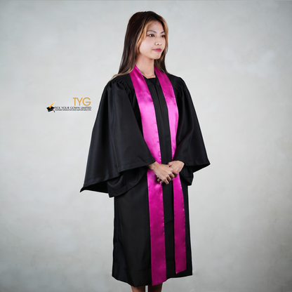 Profile view of a person wearing a black graduation gown with a pink stole on a gray background