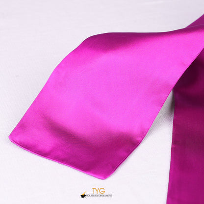 Detailed view of a pink graduation sash stole fabric on a white background.