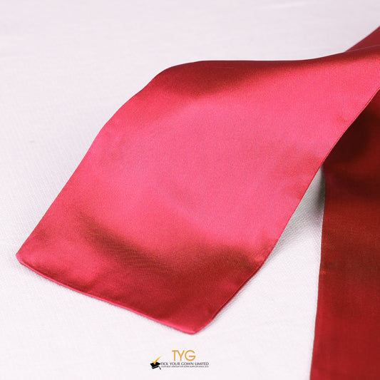 Detailed view of a red stole fabric on a white background.